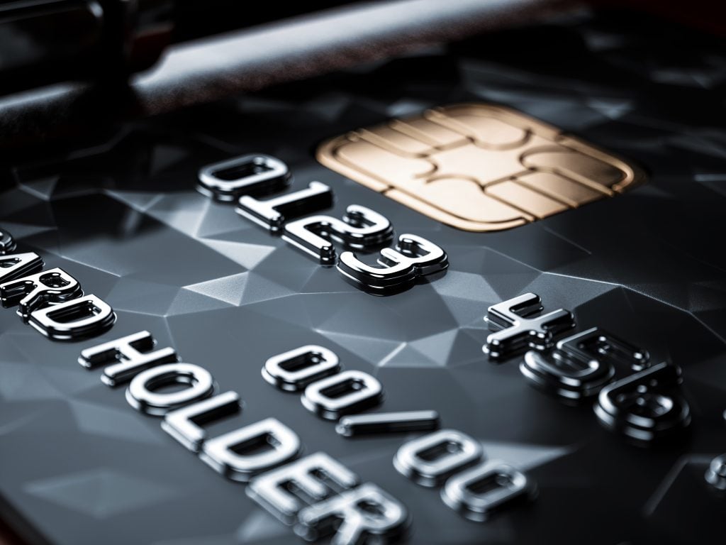 Black credit card background (apply Surge Mastercard® card).