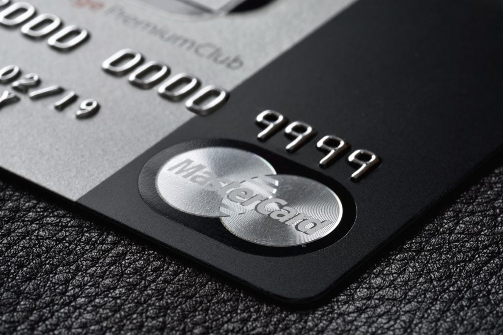 Focus on the MasterCard banner of a black credit card