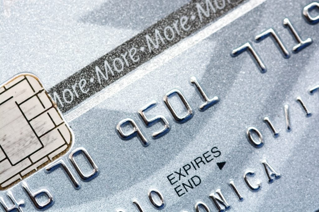 Close-up of silver credit card (Aspire® Cash Back Reward credit card)