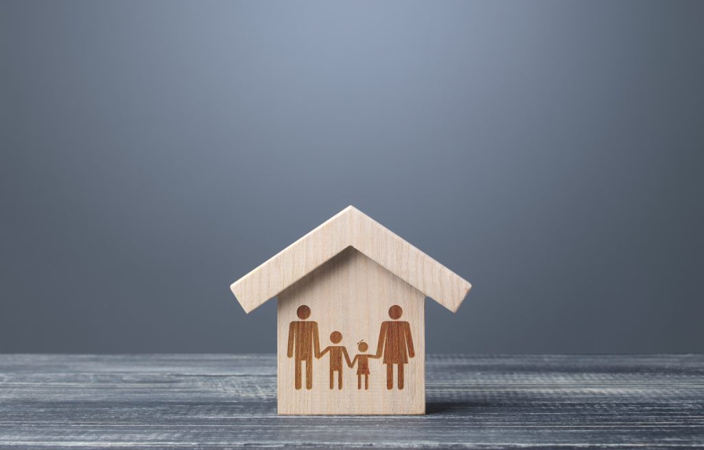 Drawing symbol of a family in a wooden house.