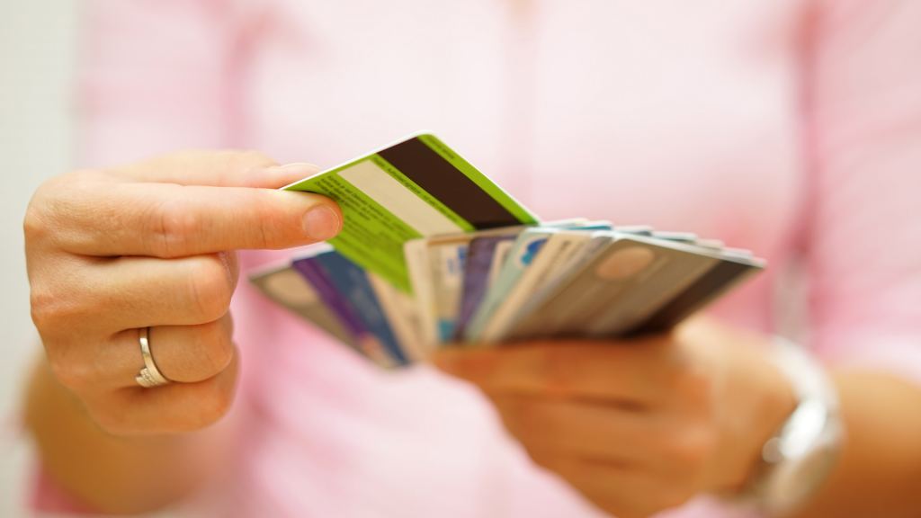 woman choose one credit card from many, concept of credit card