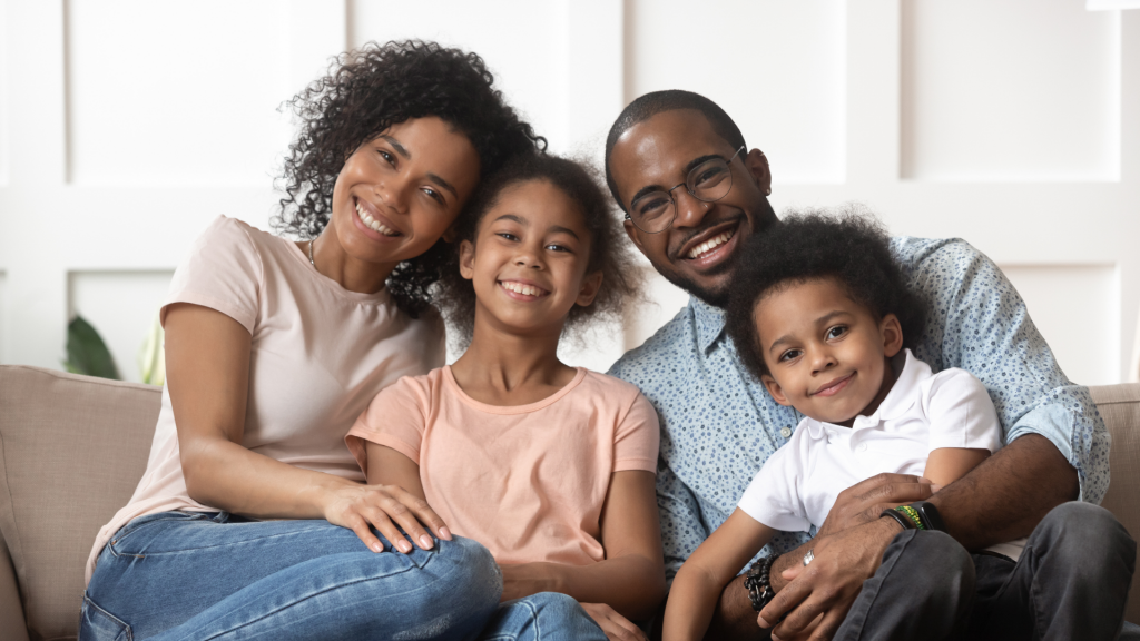 Portrait of black family with kids relax on couch. Temporary Assistance for Needy Families (TANF)