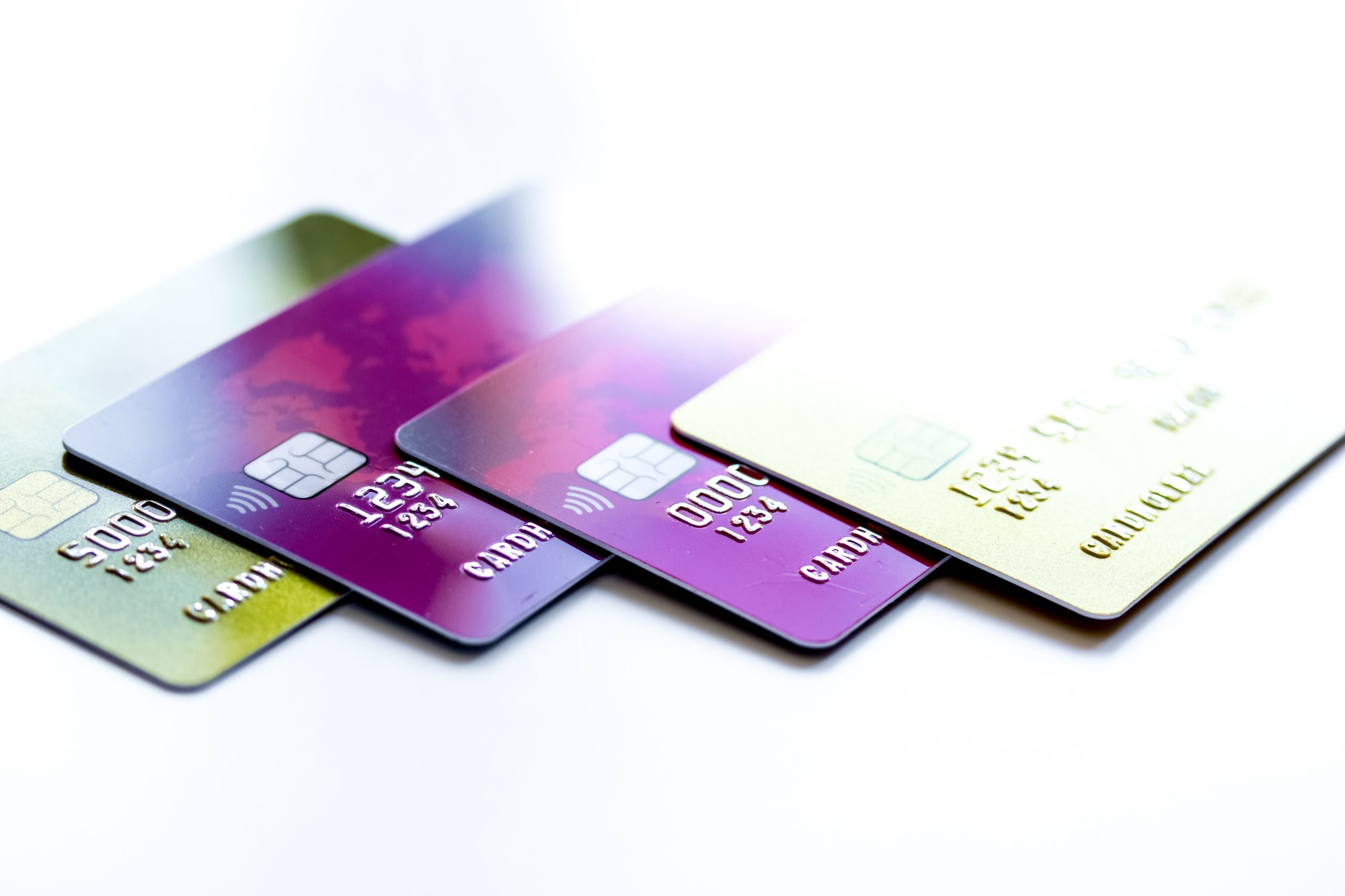 pile of credit cards on white background