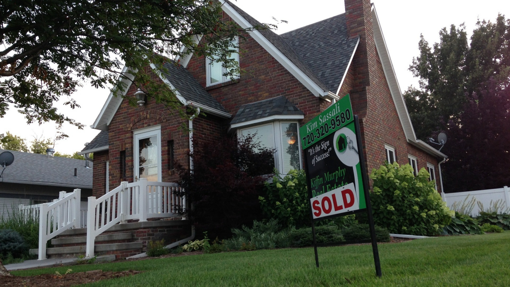 House with "sold" sign