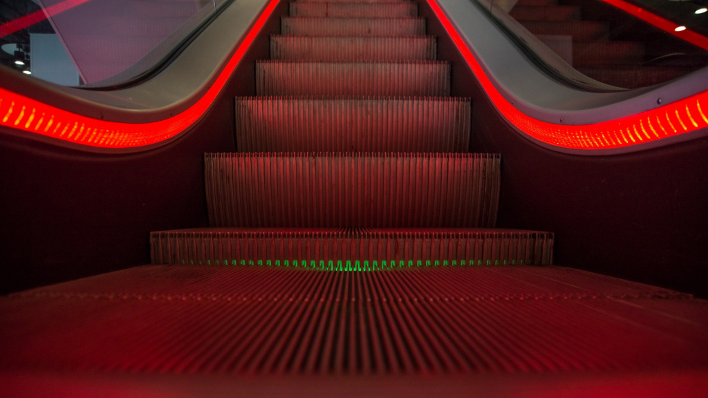 escalator illuminated by red light