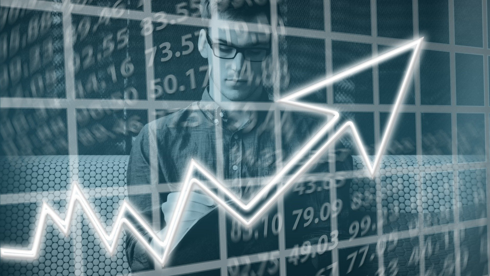 man with unfocused serious/worried profile in front of a graph indicating ascent