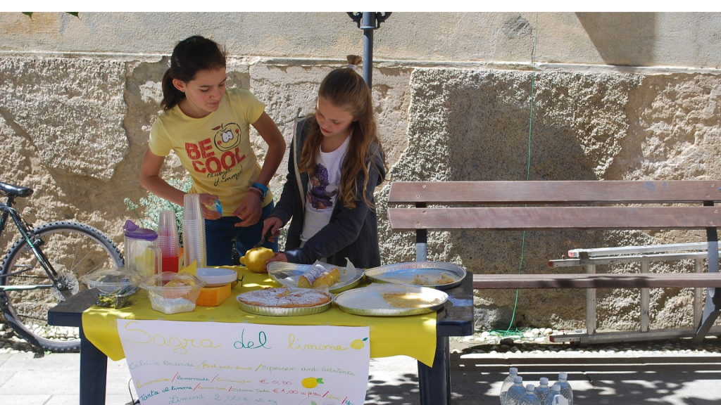 girls selling lemonade