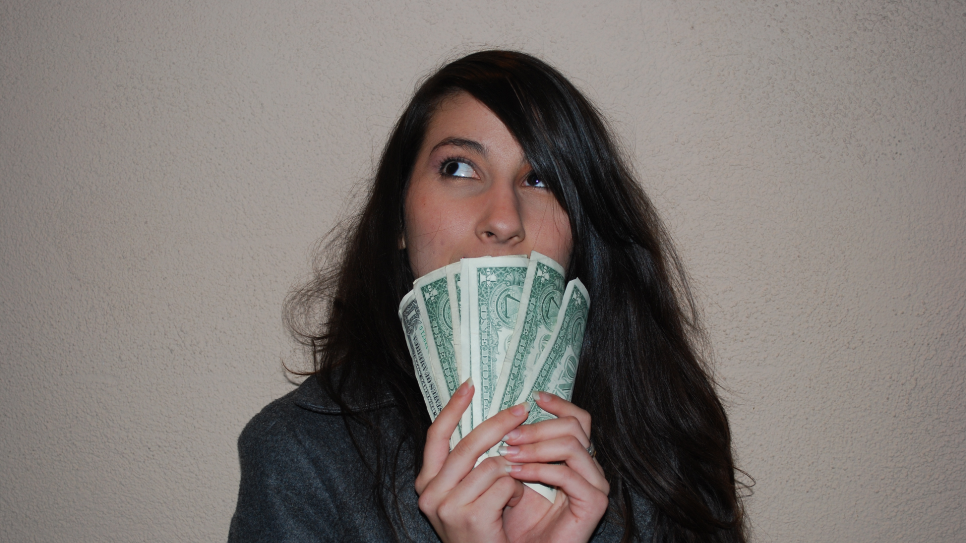 Young woman holding banknote