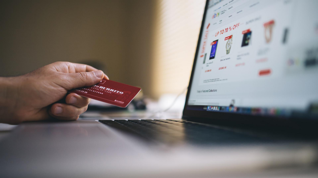 red credit card and notebook/laptop (apply Group One Platinum Card)