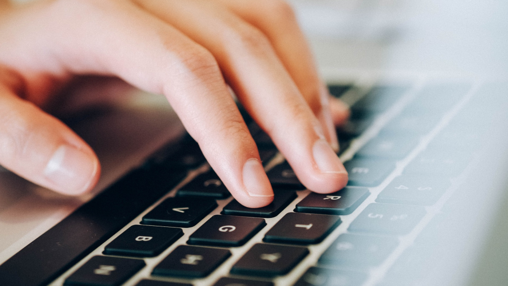 person typing on computer/notebook keyboard