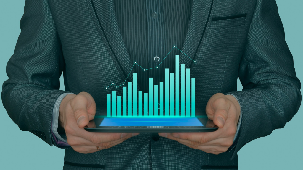 man in suit holding tablet with graphs (management, results)