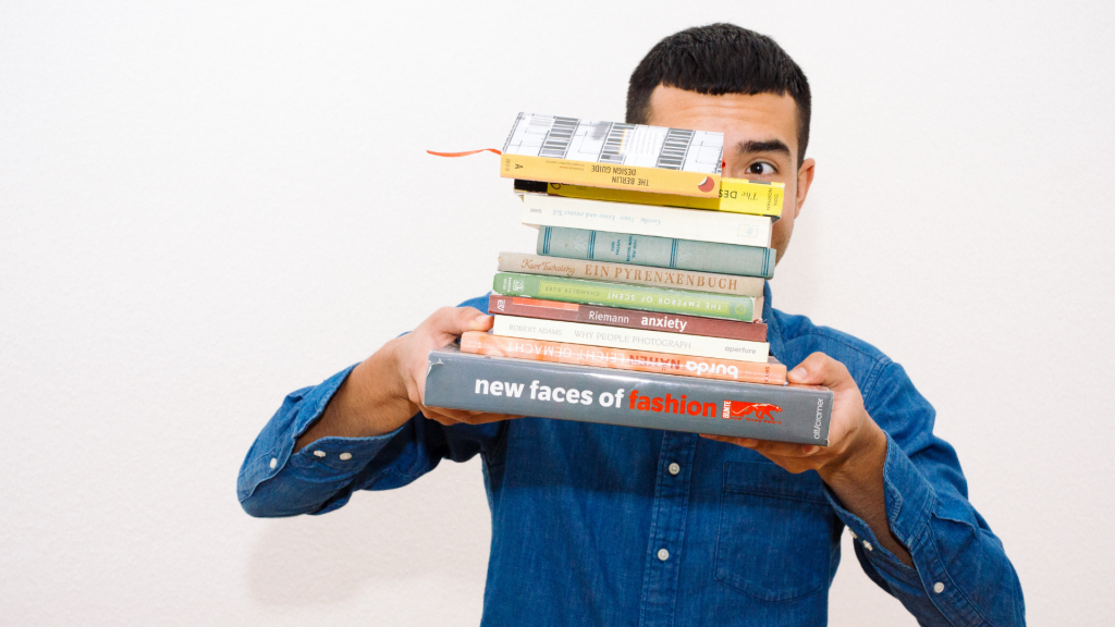 student balancing books