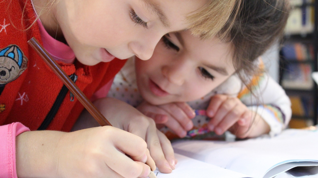 two children solving an exercise at school