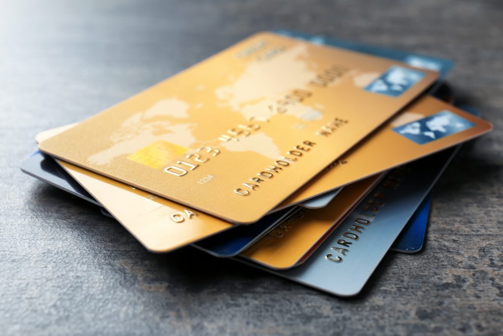 Pile of credit cards on table, closeup