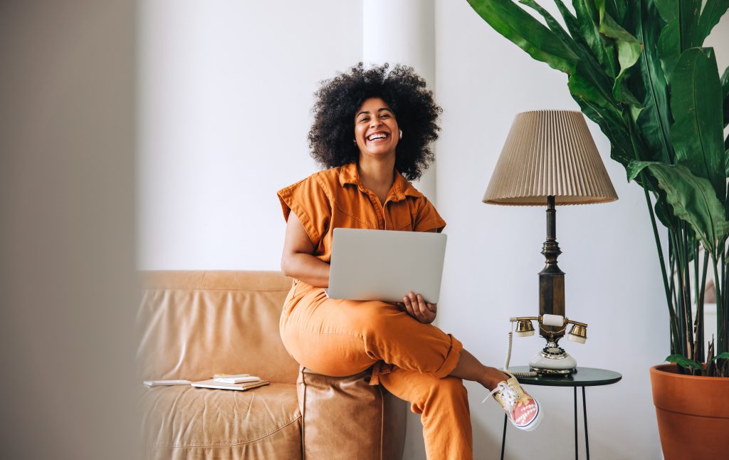 Businesswoman smiling cheerfully in an office lobby