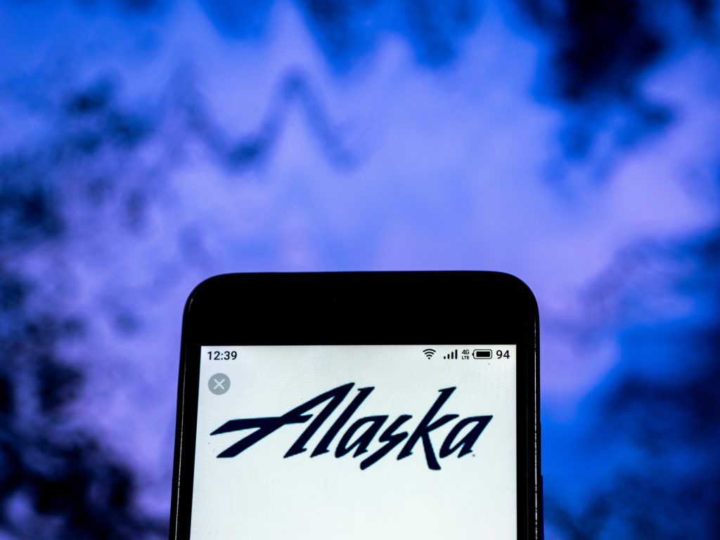 Alaska Airlines logo seen displayed on smart phone