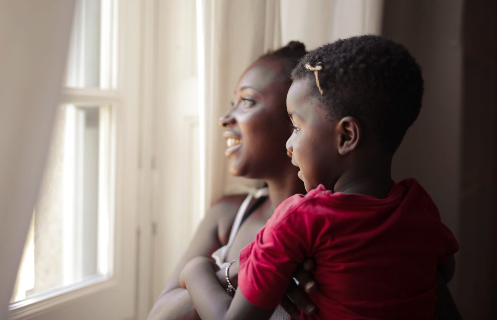 mother and son looking out the window